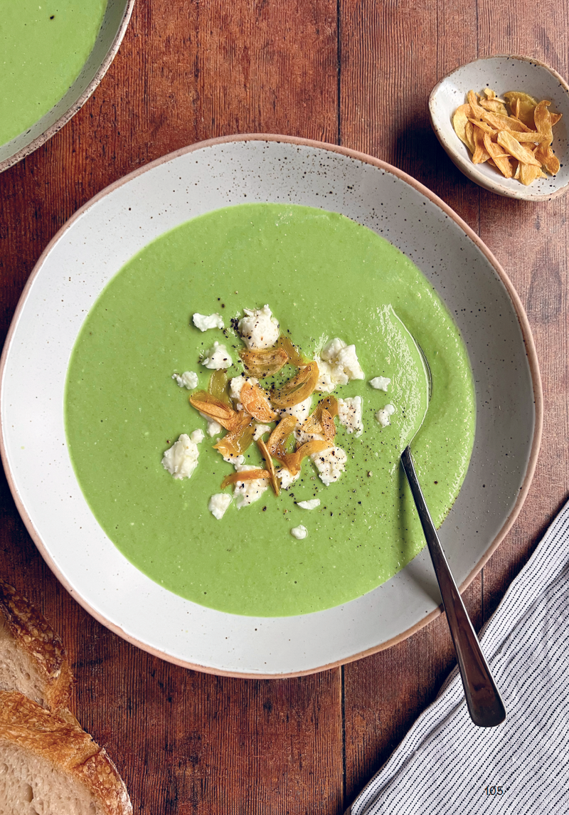 Green pea soup with feta and toasted seeds, served with crusty bread